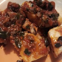 A picture of Boiled yam with scent leaf sauce.