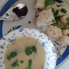 A picture of Gujarati kadhi and sooji dhokla.