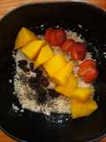 Breakfast (oatmeal with chia seed, raisin, yogurt and sliced fruit)