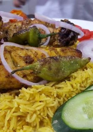 A picture of Zafarani rice with tikka.