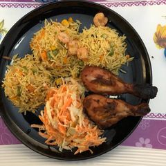 A picture of Basmati rice,coleslawband grilled chicken.
