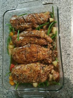 A picture of Oven roasted chicken with veggies.