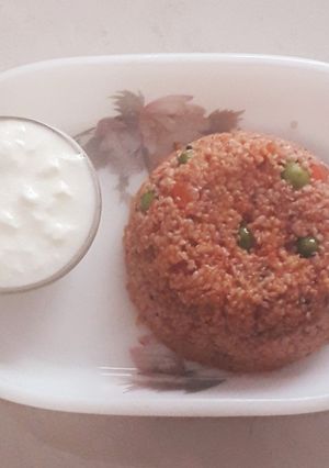 A picture of Tomato dalia pulao.