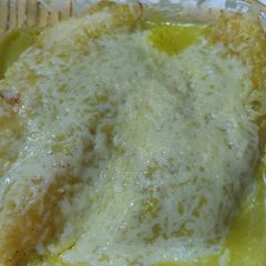 A picture of Stuffed crepes with Mexican green sauce.