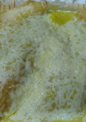 A picture of Stuffed crepes with Mexican green sauce.