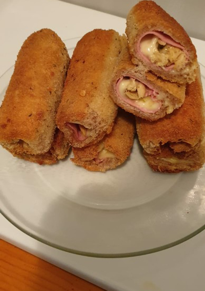 Una foto de Canutillos de pollo con pavo y queso