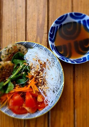 A picture of Vermicelli salad with coriander chicken meatballs.