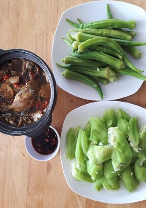 A picture of Caramelized Fish in Clay Pot with Boiled Vegetables.