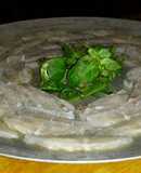 Sashimi de panga con rúcula y canónigos