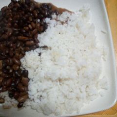 A picture of Stewed Bean served with Boiled Rice.