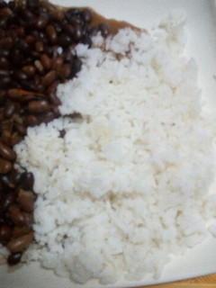 A picture of Stewed Bean served with Boiled Rice.