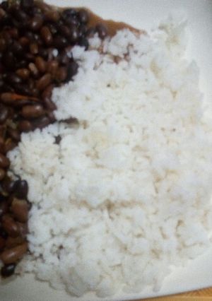 A picture of Stewed Bean served with Boiled Rice.