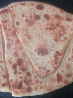 A picture of Shankh/ conch shaped layered paratha.