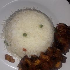 A picture of White rice and gizdodo sauce.