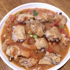 A picture of Stew Chicken Wings with Tomatoes.