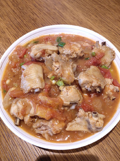 A picture of Stew Chicken Wings with Tomatoes.