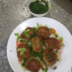 A picture of Gola kabab chicken with mint chutney.