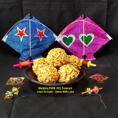 A picture of Murmura Til Gud Ladoo - Puffed Rice Sesame Jaggery Ladoo.