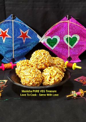 A picture of Murmura Til Gud Ladoo - Puffed Rice Sesame Jaggery Ladoo.