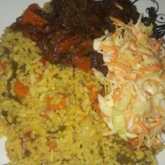 A picture of Fride rice with peppered chiken.