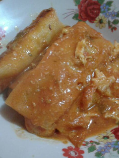 Una foto de Canelones con queso y pollo