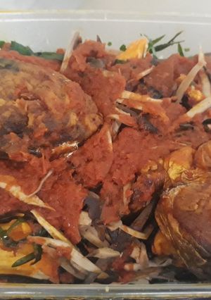 A picture of Roasted yam with ugba and fish.