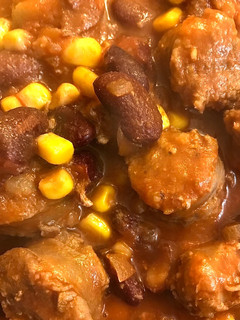 A picture of Beef sausages in tomato sauce.
