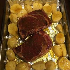 A picture of Beef stake with potatoes.