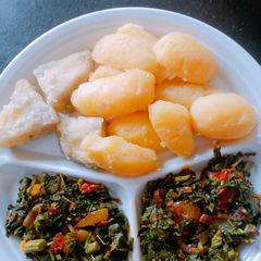 A picture of Bolied Irish/Sweet potatoes with veggies.