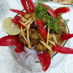A picture of Punjabi choly with mint chattny curd.