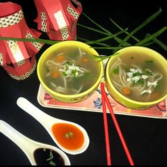 A picture of Chicken veggies noodles soup.