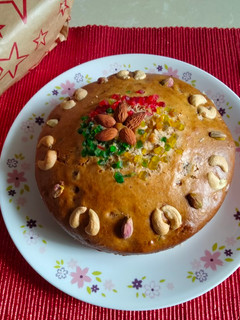 A picture of Plum cake -loaded with dry fruits (soaked in red grapes juice).