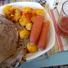 A picture of Vanilla flavoured pancake, viazi karai, smokies & tarmarid juice.