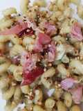 Cellentani carciofi speck e granella di nocciole