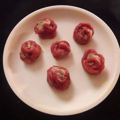 A picture of Beetroot rose vapa pitha.