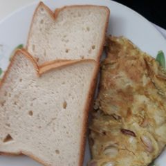 Sliced bread with fried egg A picture of Sliced bread with fried egg.