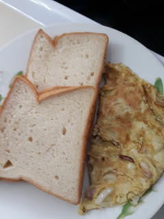 A picture of Sliced bread with fried egg.