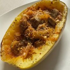 A picture of Spaghetti Squash with Spicy Italian Sausage.