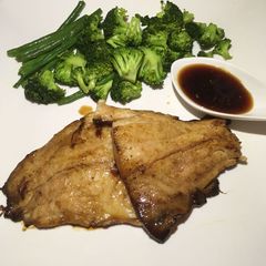 A picture of Honey glazed fish with steamed veggies.