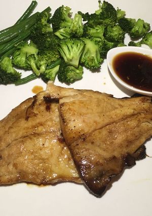 A picture of Honey glazed fish with steamed veggies.