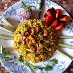 A picture of Wheat dalia khichri with winter vegetables.