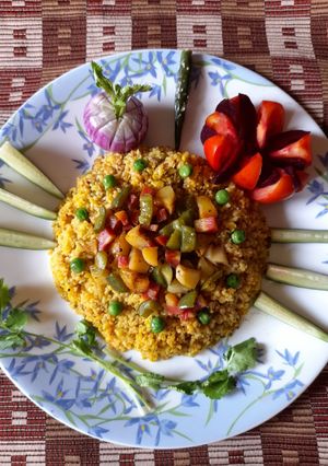 A picture of Wheat dalia khichri with winter vegetables.