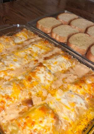 A picture of Blackened chicken Alfredo lasagna roll ups.