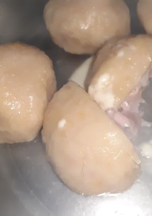 Una foto de Ñoquis de zapallo rellenos de jamón y queso
