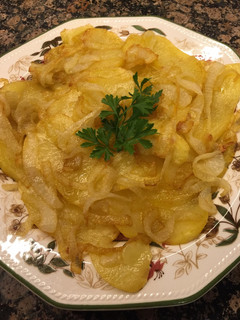 Una foto de Patatas panadera y cebollita