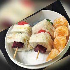 A picture of Shashlik style cube sandwiches.