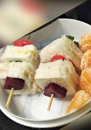 A picture of Shashlik style cube sandwiches.