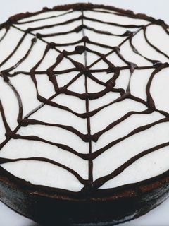Una foto de Tarta de queso de tela de araña para Halloween (sin horno)