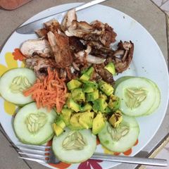 A picture of Grilled chicken with cucumber,carrots and avacado.