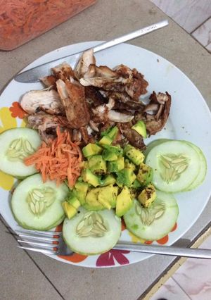 A picture of Grilled chicken with cucumber,carrots and avacado.